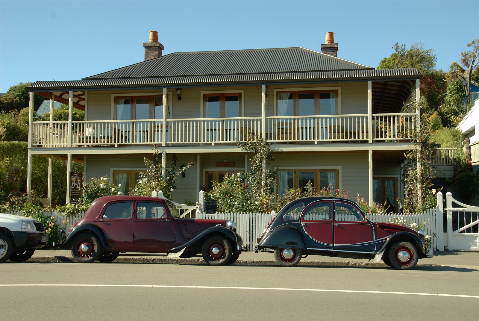Two vintage Citroëns parked in Akaroa