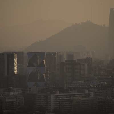 A hazy, city skyline seen through a heavy layer of smog.