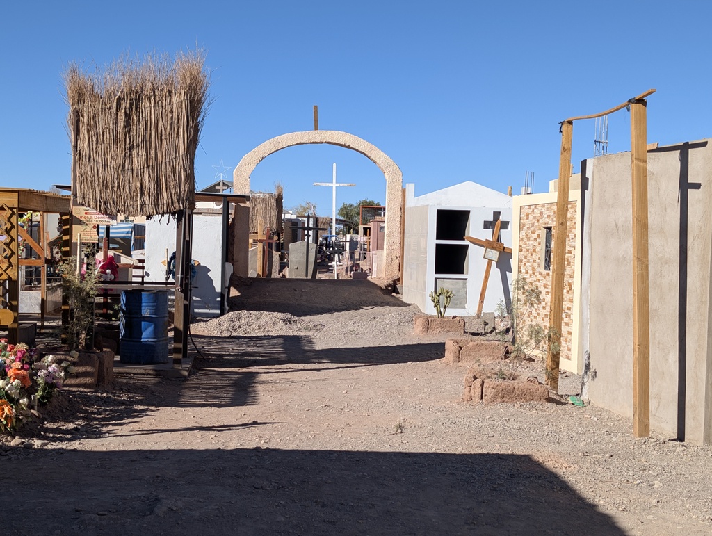 An arched entrance to a cemetery or memorial site.