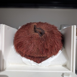 A reddish brown furry lablet.ck